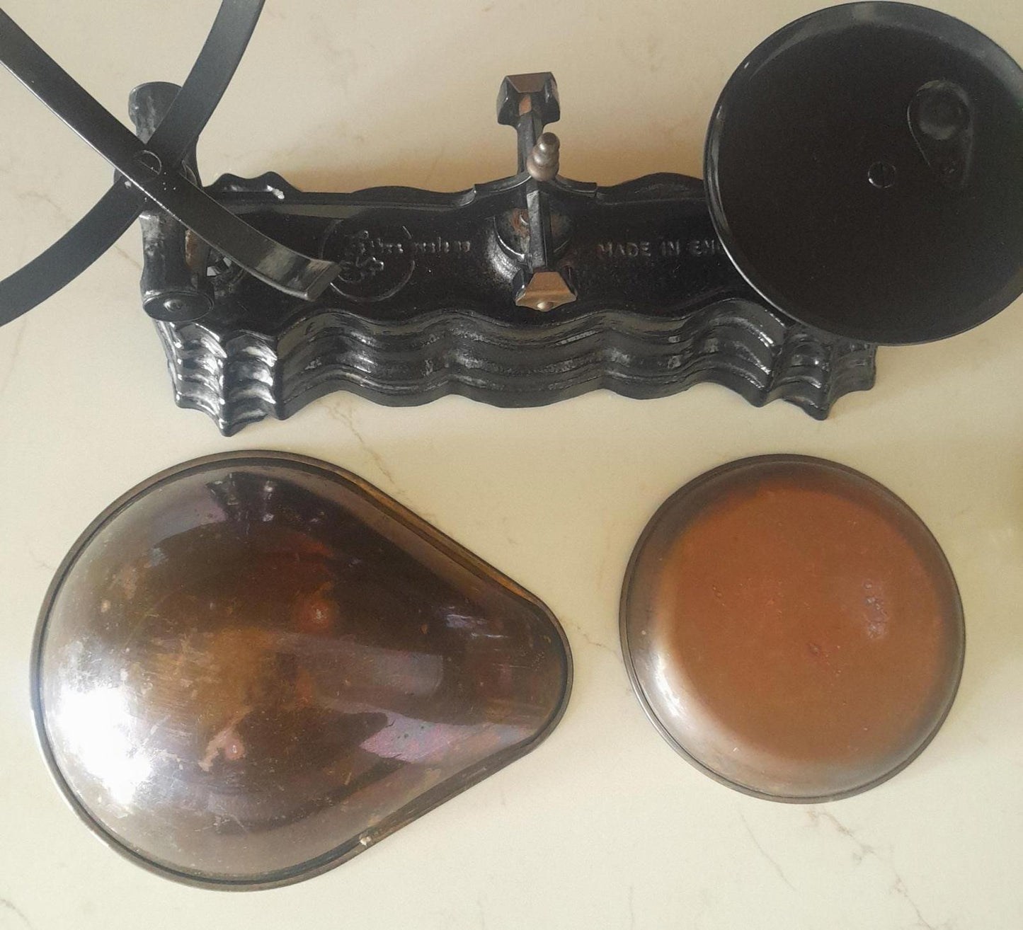 Vintage Black cast iron and brass Libra scales with 7 Bell weights.