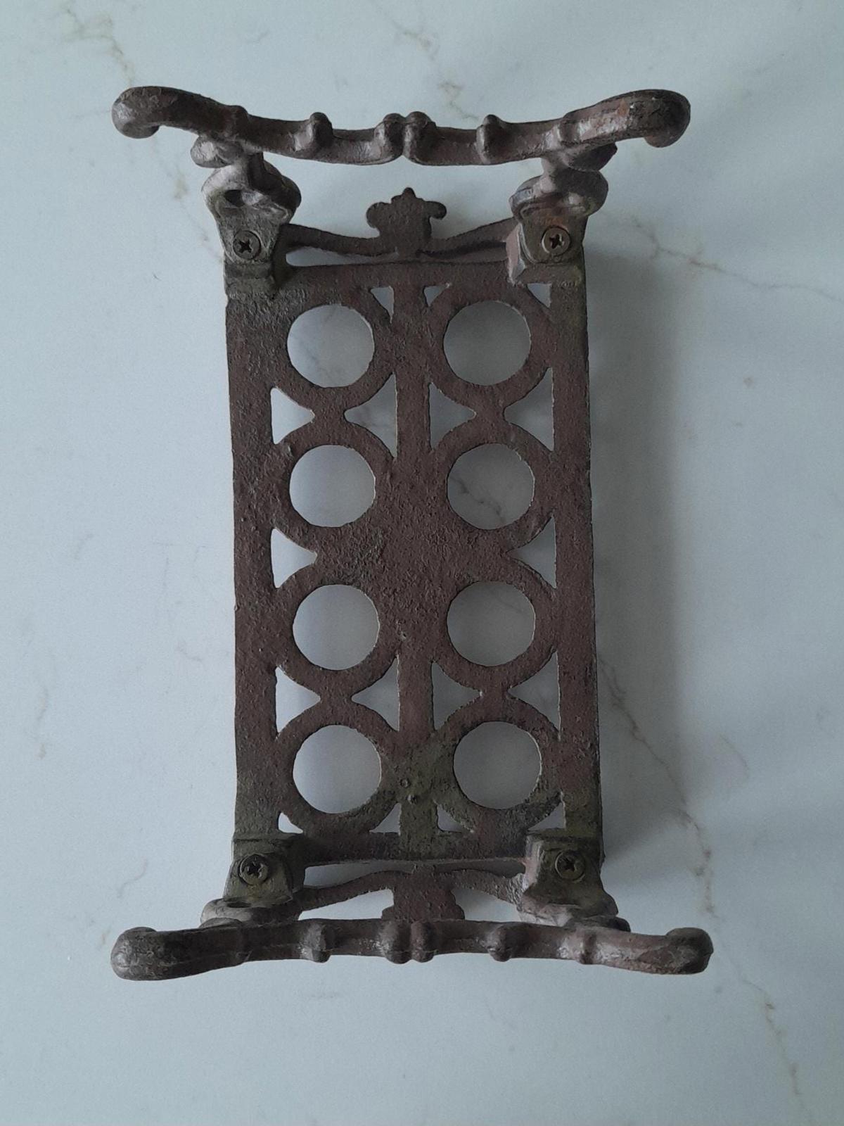 Rustic brown cast iron garden cuttings holder - it will need glass test tubes