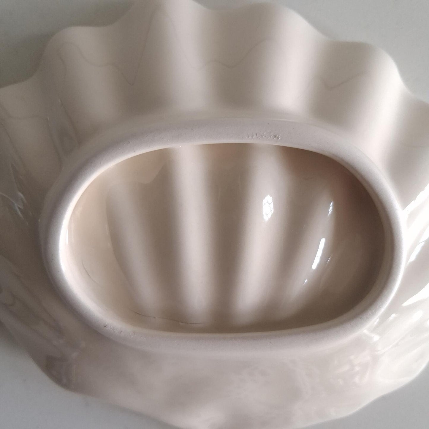 Small cream shell shaped dish