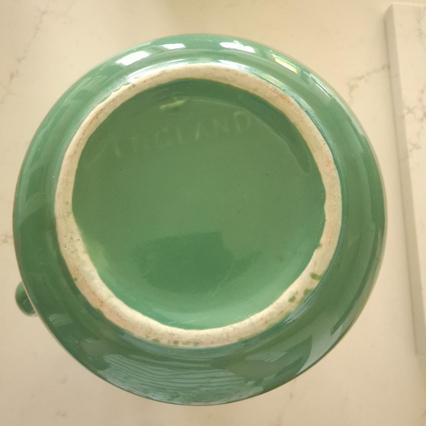 Large vibrant green pottery pitcher