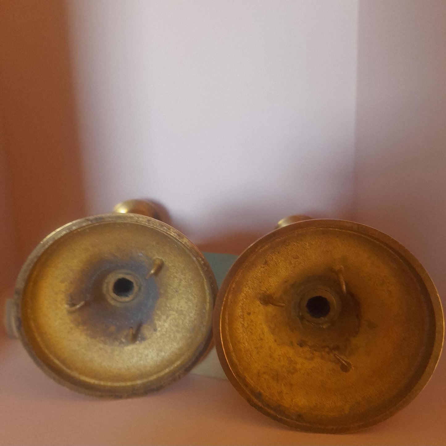 A pair of solid brass candlestick holders