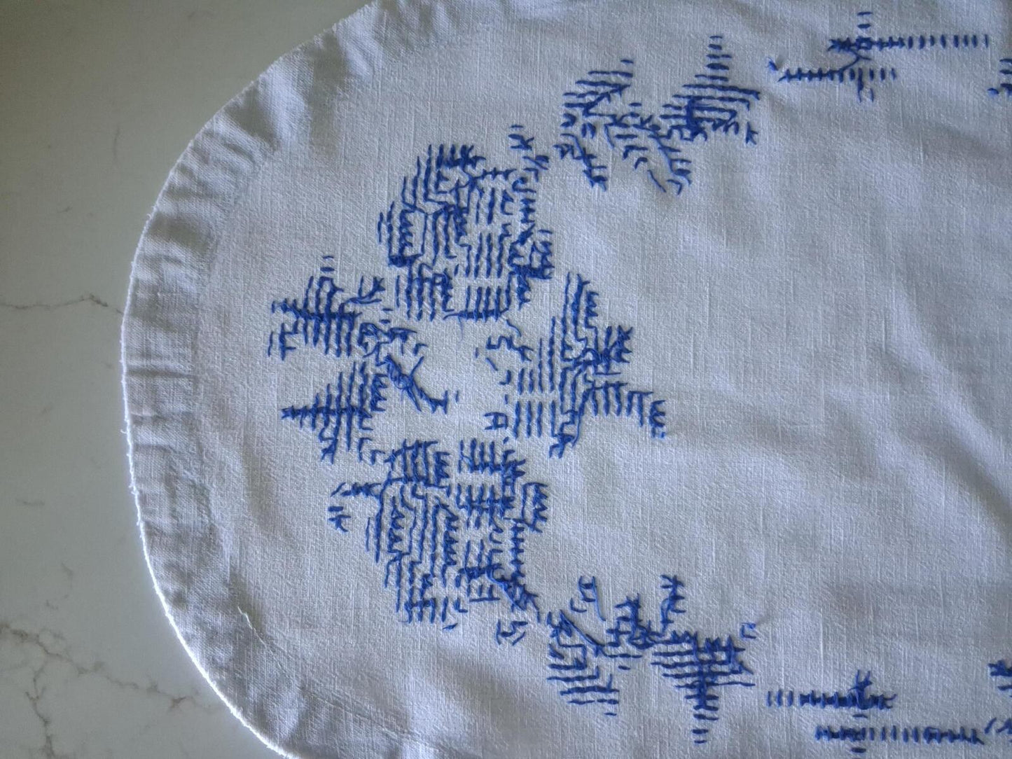 Oval blue and white cross stitch centrepiece cloth 65cm x 34.5cm