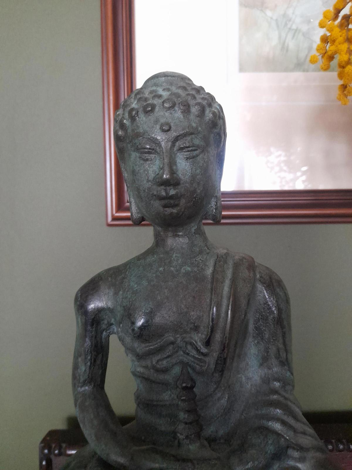 Tibetan bronze figure of a Buddha seated in the lotus position