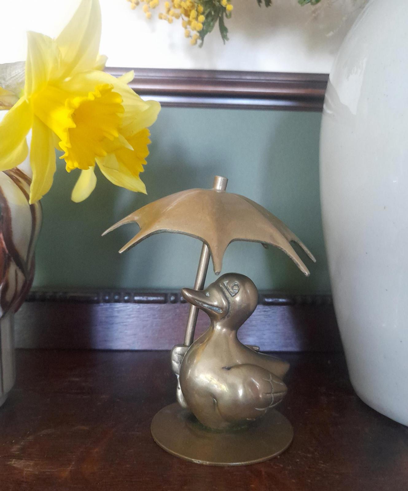 Brass duck with an Umbrella