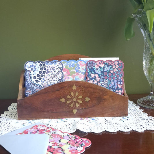 Wooden letter holder with floral brass inlay