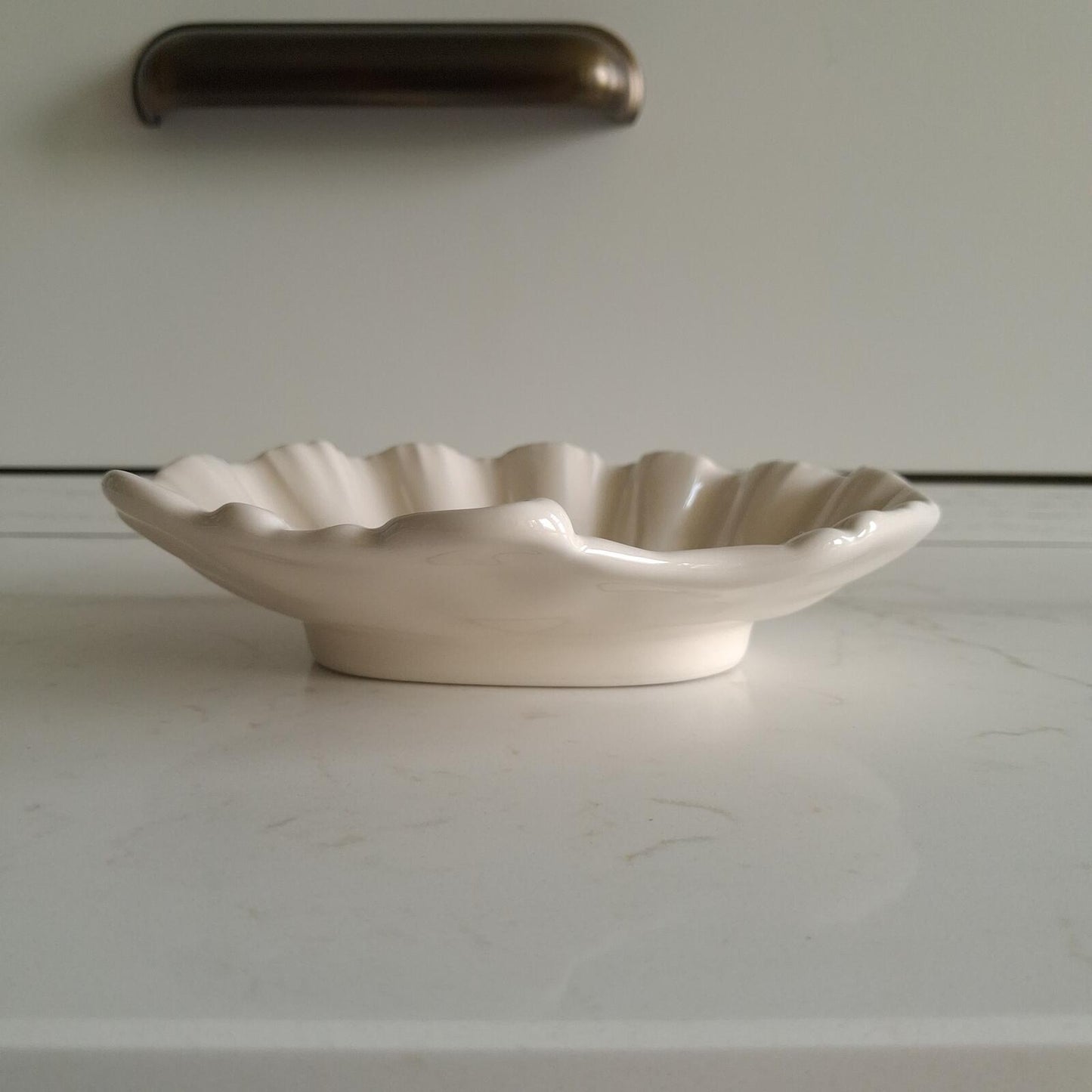 Small cream shell shaped dish