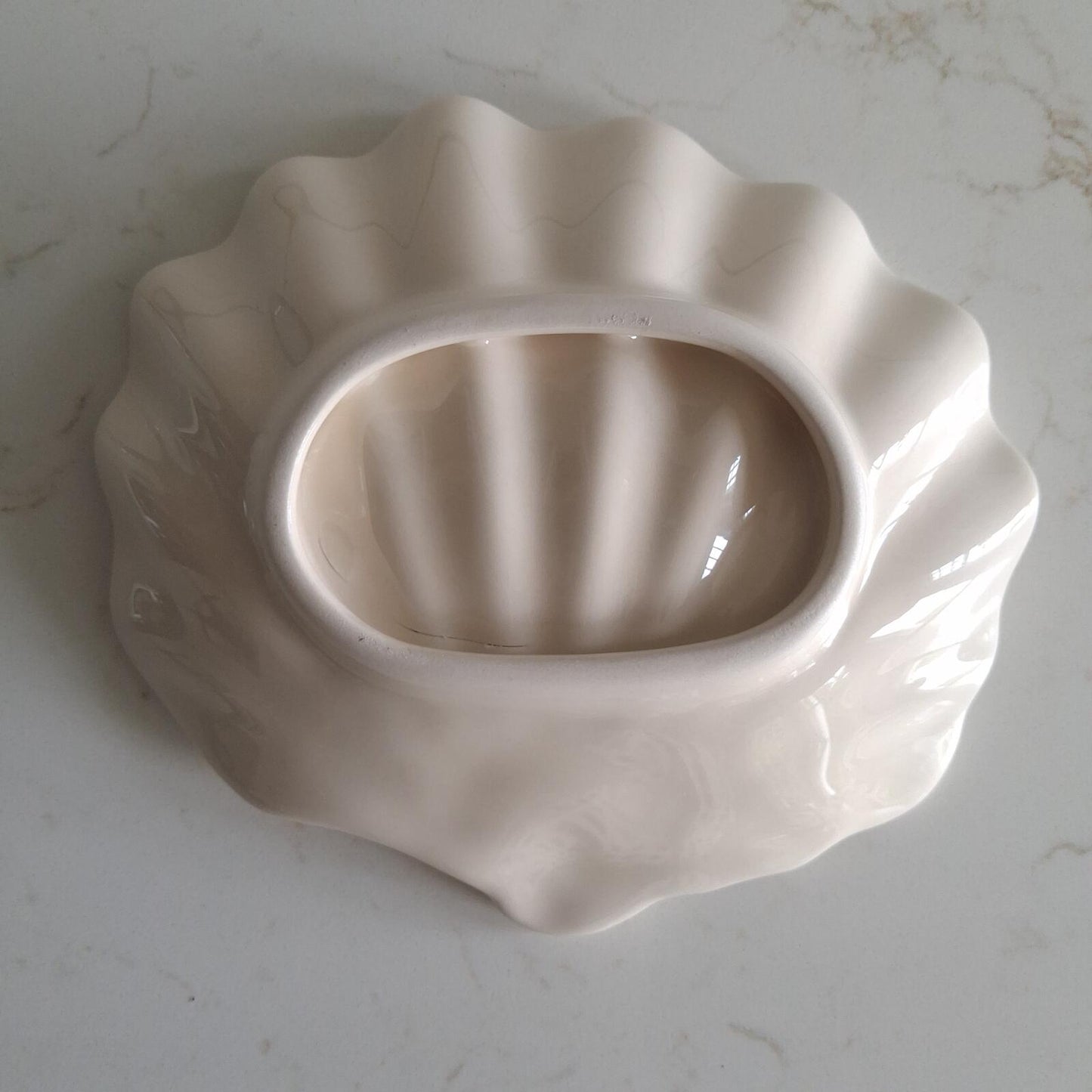 Small cream shell shaped dish