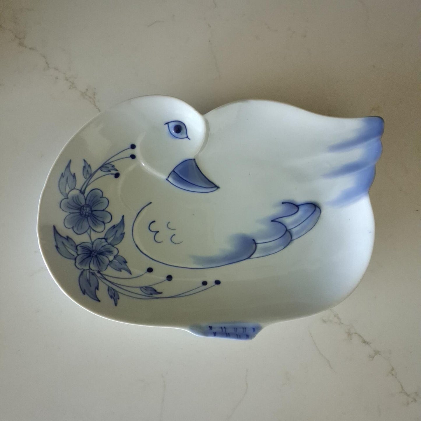Blue and white floral duck shaped plate