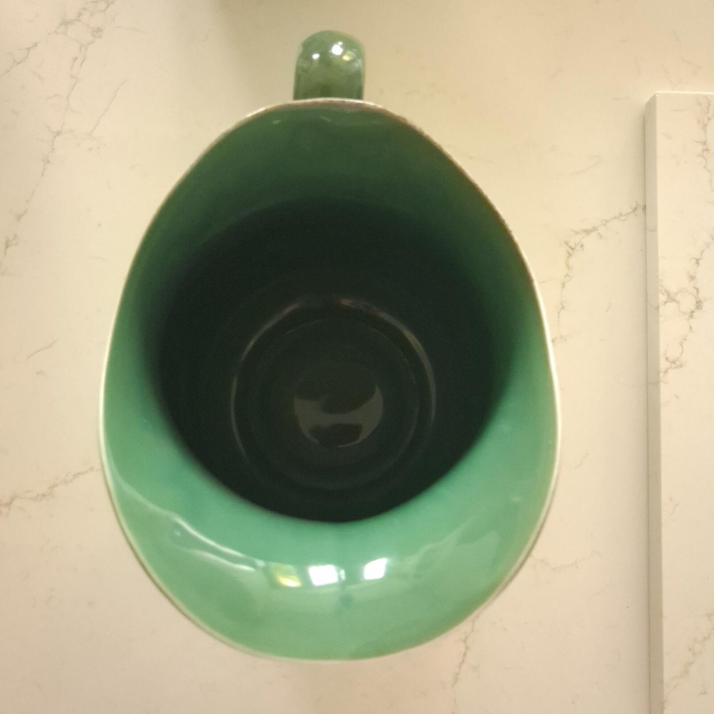 Large vibrant green pottery pitcher