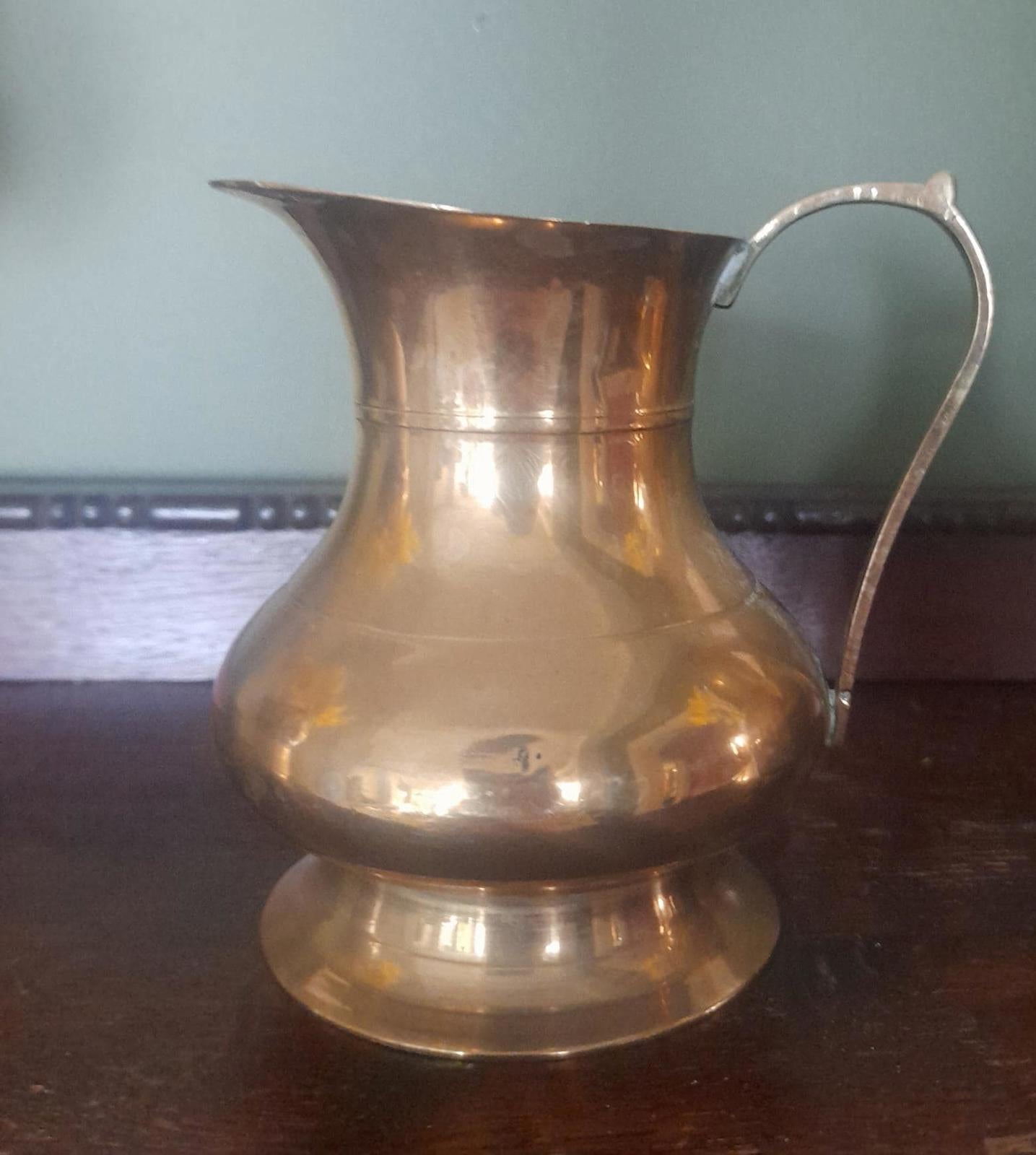 A pair of small brass jugs 5" tall