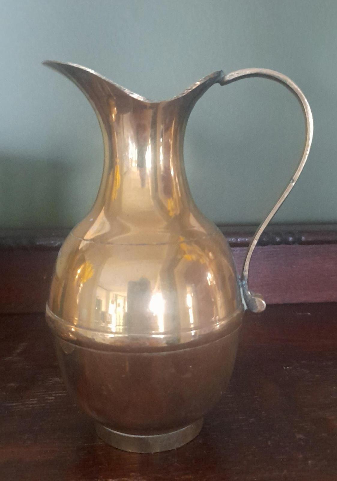 A pair of small brass jugs 5" tall