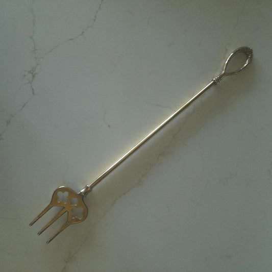 Long brass fireside hanging toasting fork