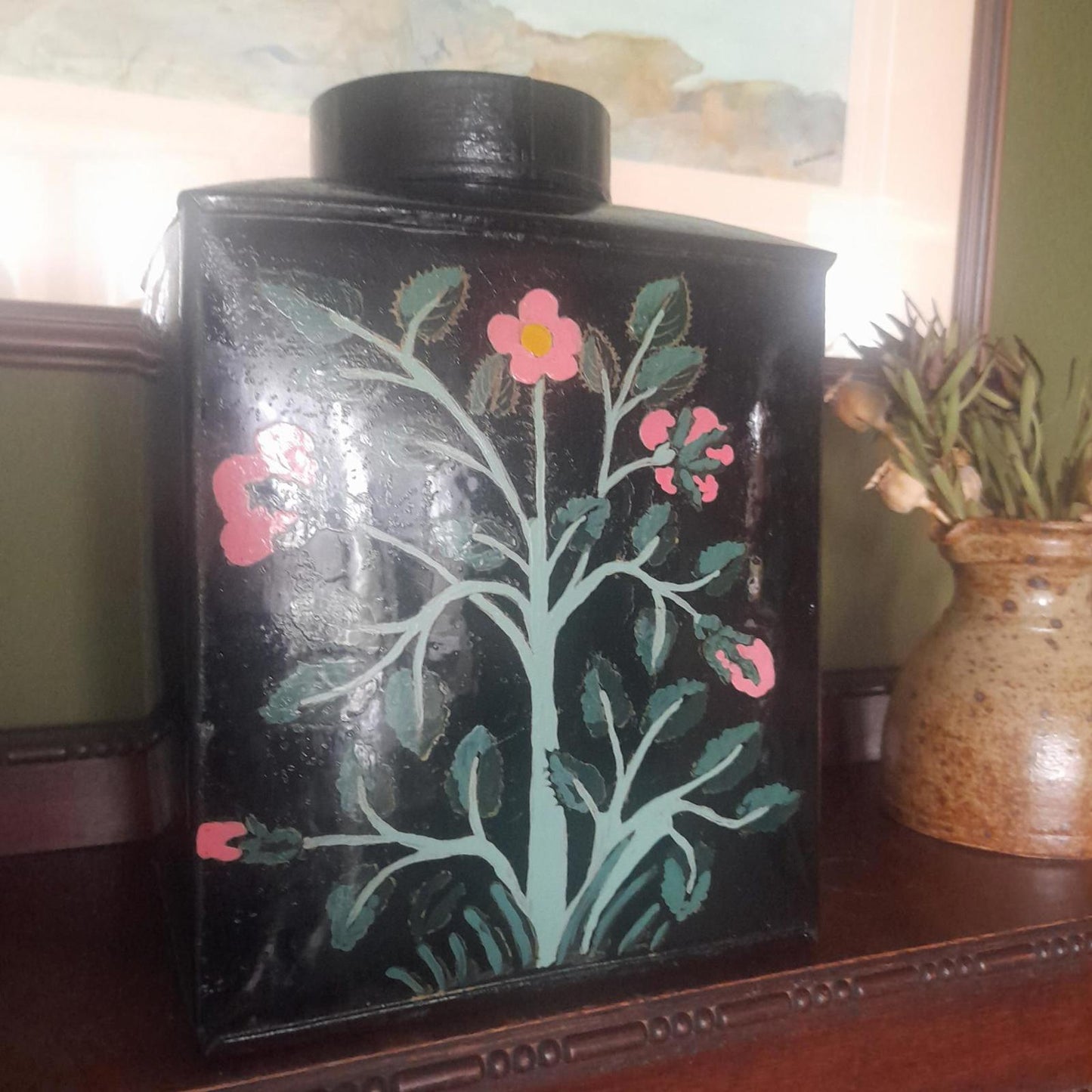Large metal lidded tin with black lacquered finish hand painted flowers