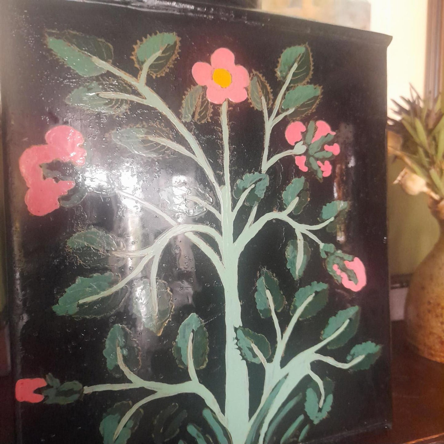 Large metal lidded tin with black lacquered finish hand painted flowers