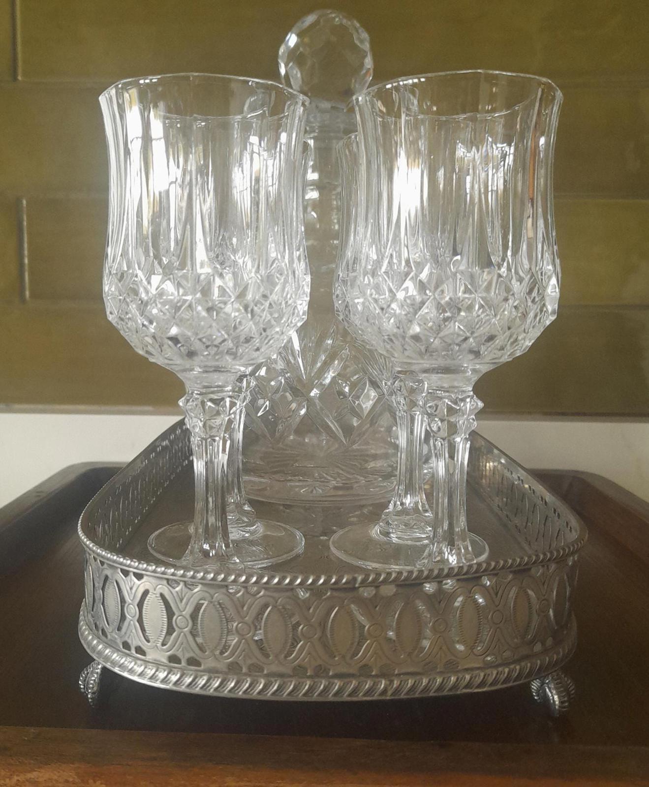 Royal Doulton decanter, longchamp glasses & a silver plated tray.