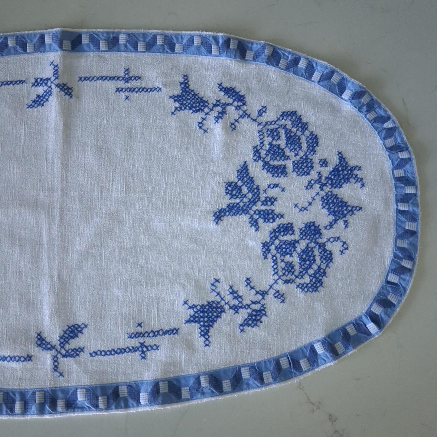 Oval blue and white cross stitch centrepiece cloth 65cm x 34.5cm