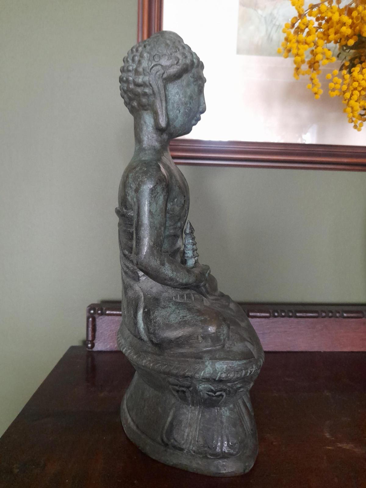 Tibetan bronze figure of a Buddha seated in the lotus position