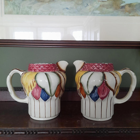 A pair of Art Deco style H. J Wood Ltd Burslem handpainted jugs.