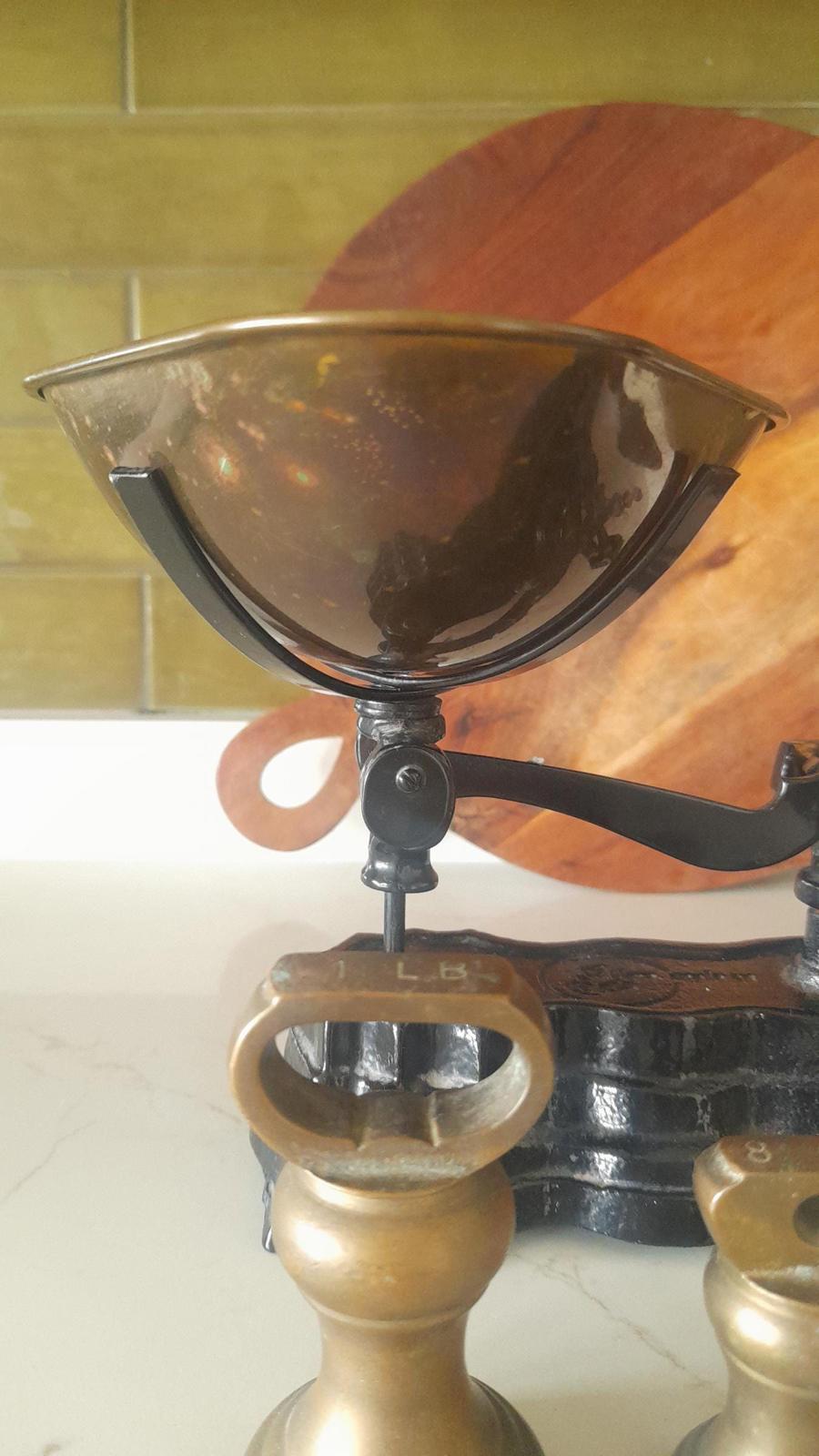 Vintage Black cast iron and brass Libra scales with 7 Bell weights.