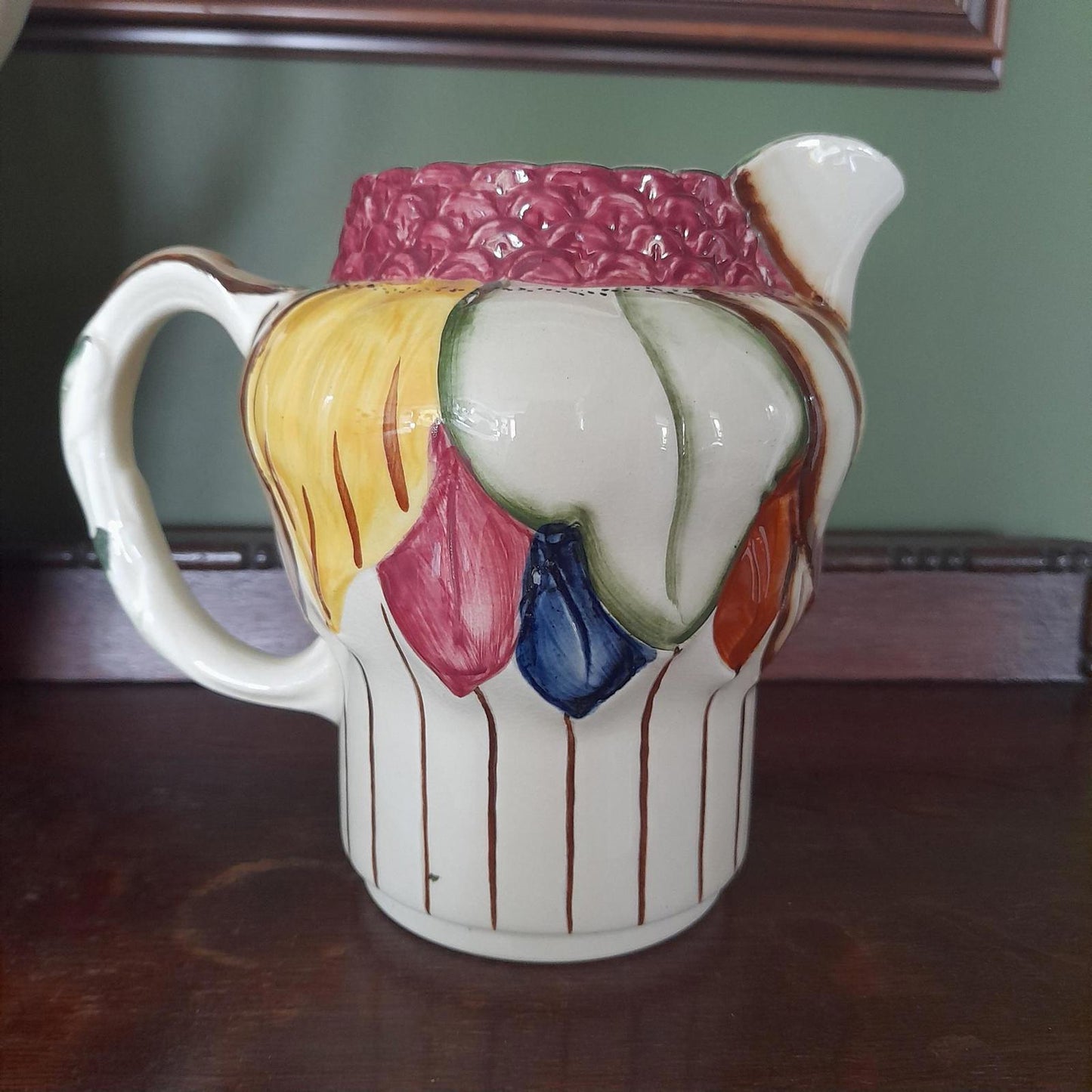 A pair of Art Deco style H. J Wood Ltd Burslem handpainted jugs.