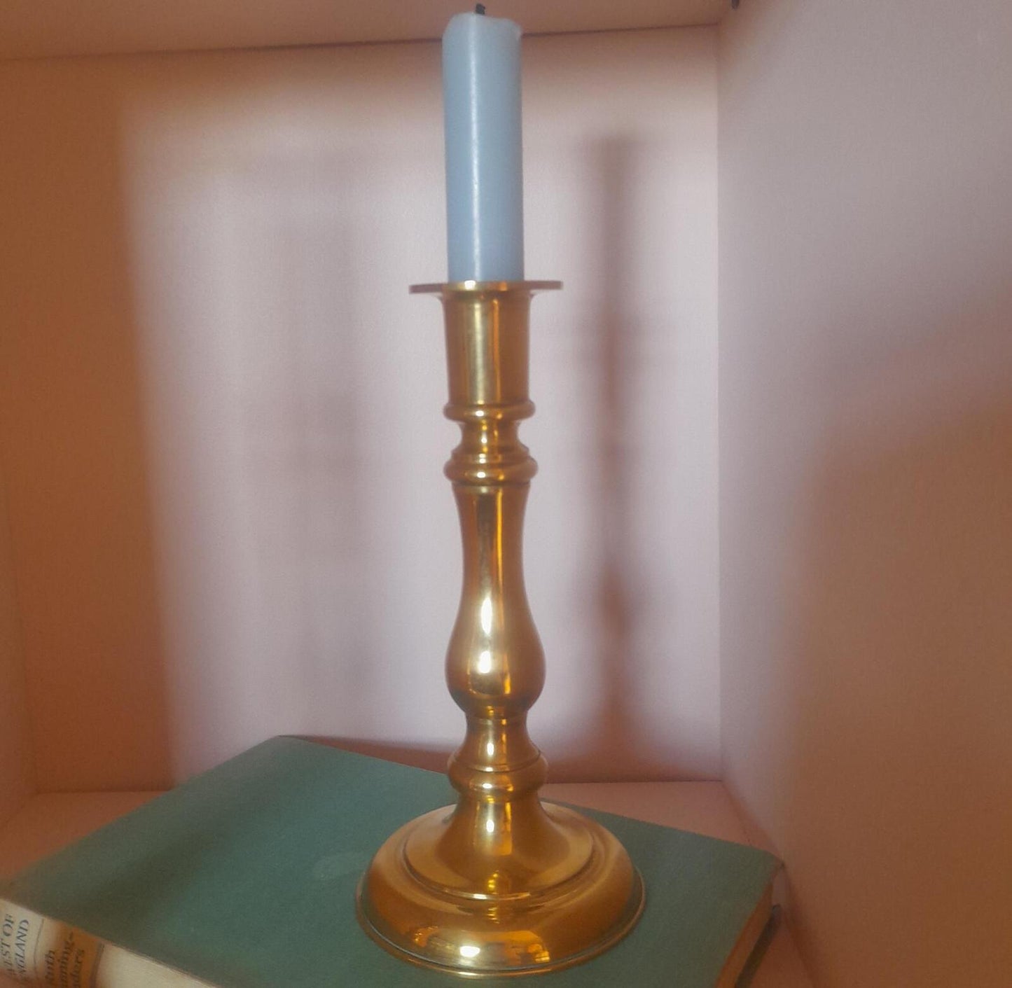 A pair of solid brass candlestick holders