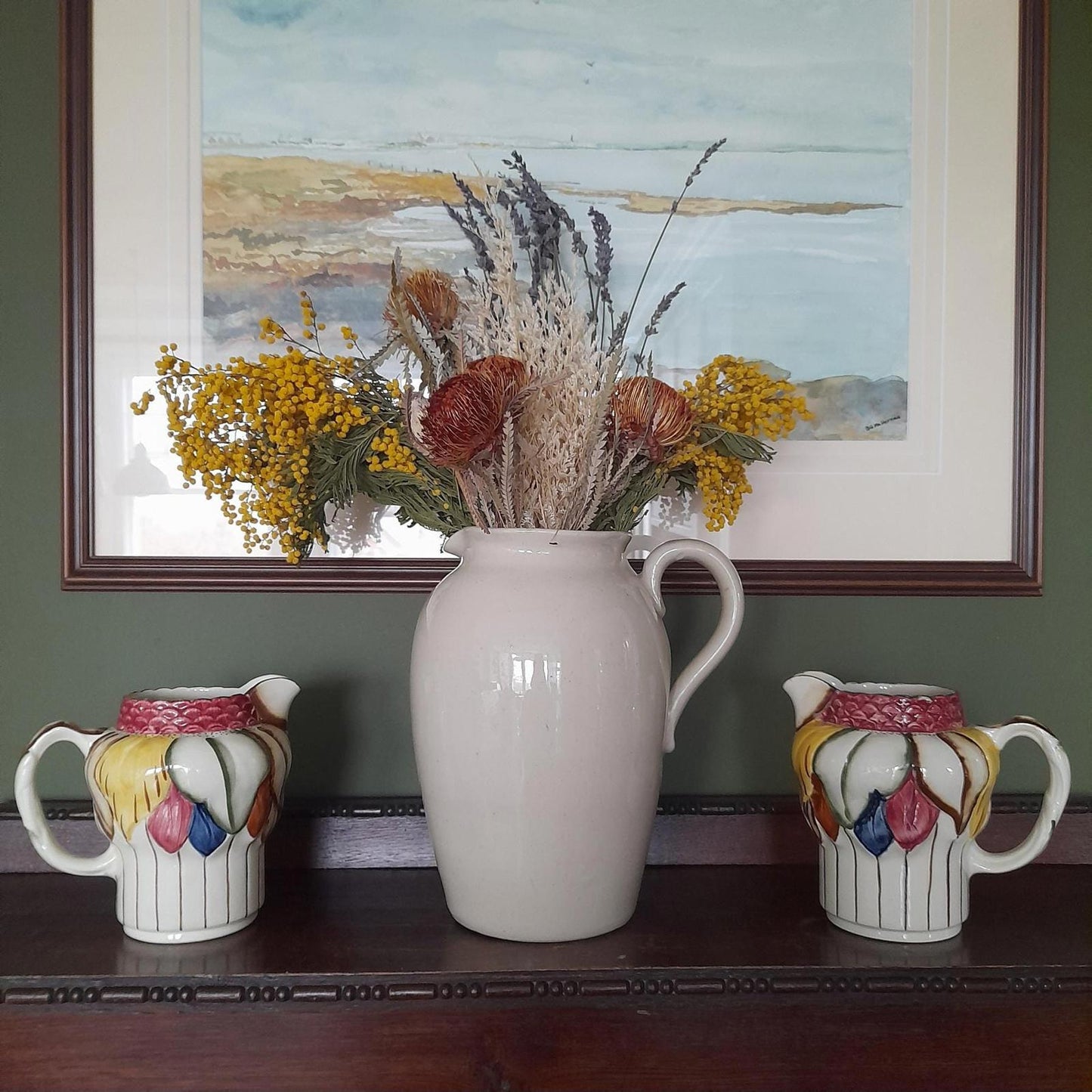 A pair of Art Deco style H. J Wood Ltd Burslem handpainted jugs.