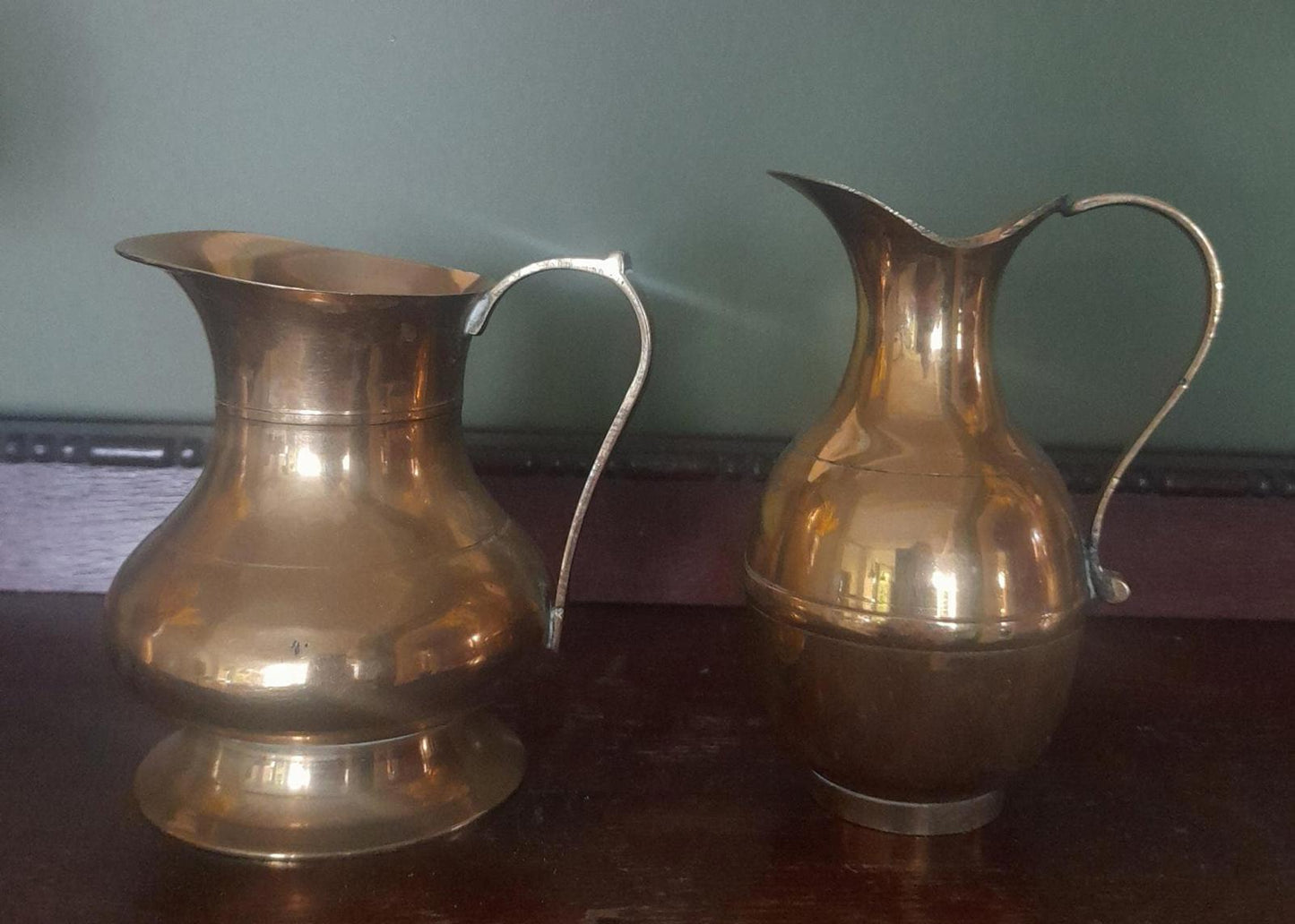 A pair of small brass jugs 5" tall