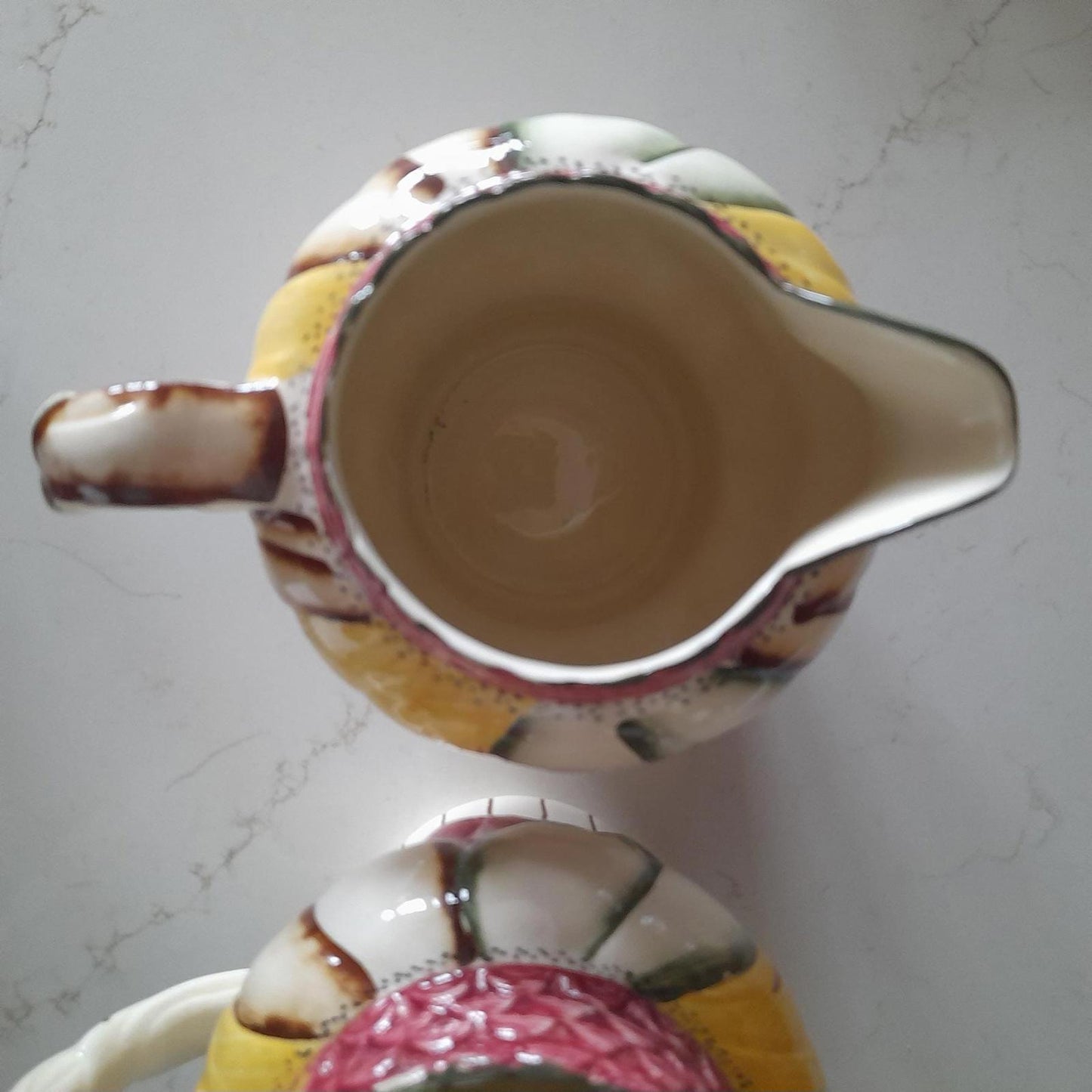 A pair of Art Deco style H. J Wood Ltd Burslem handpainted jugs.