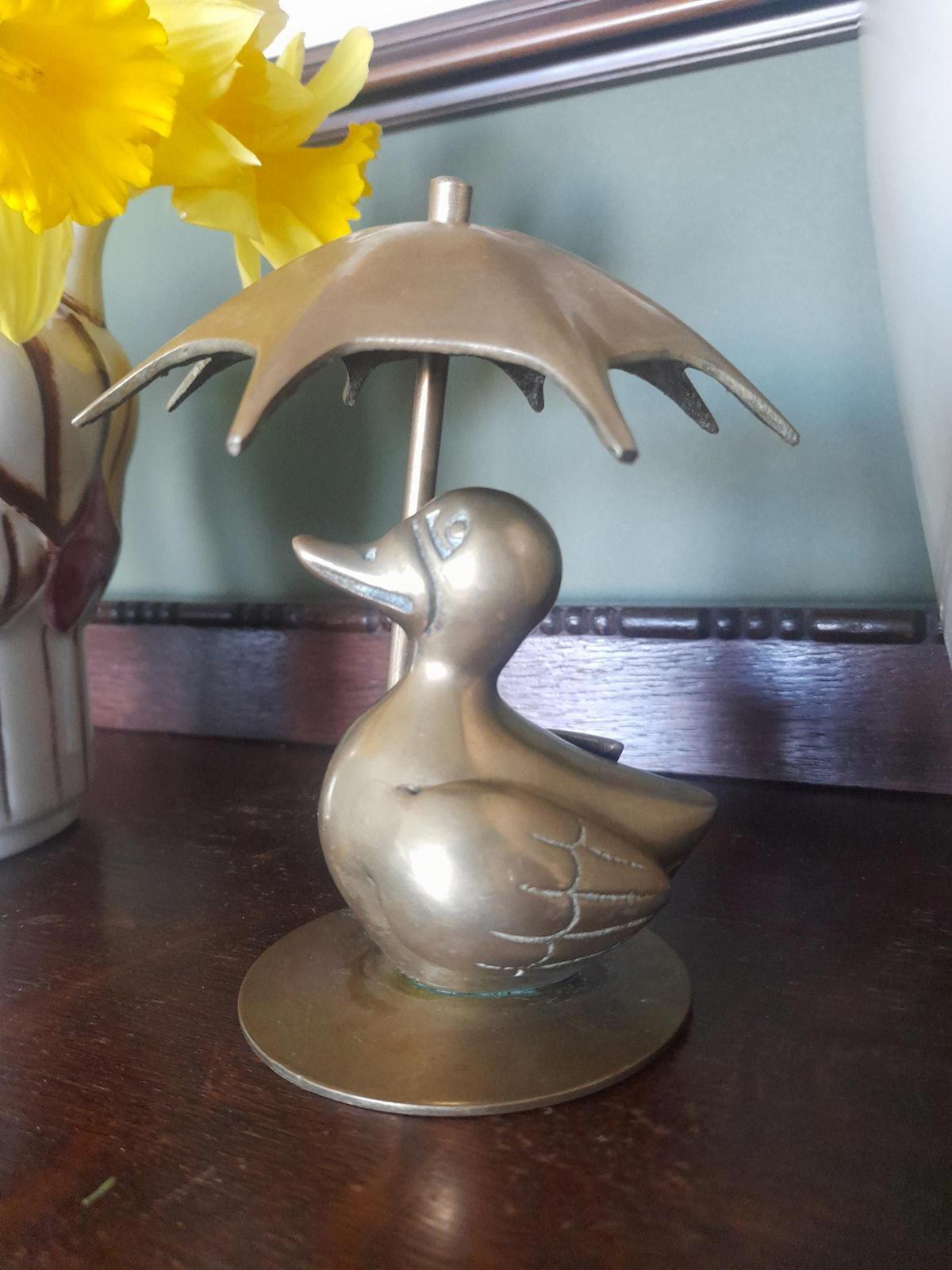 Brass duck with an Umbrella