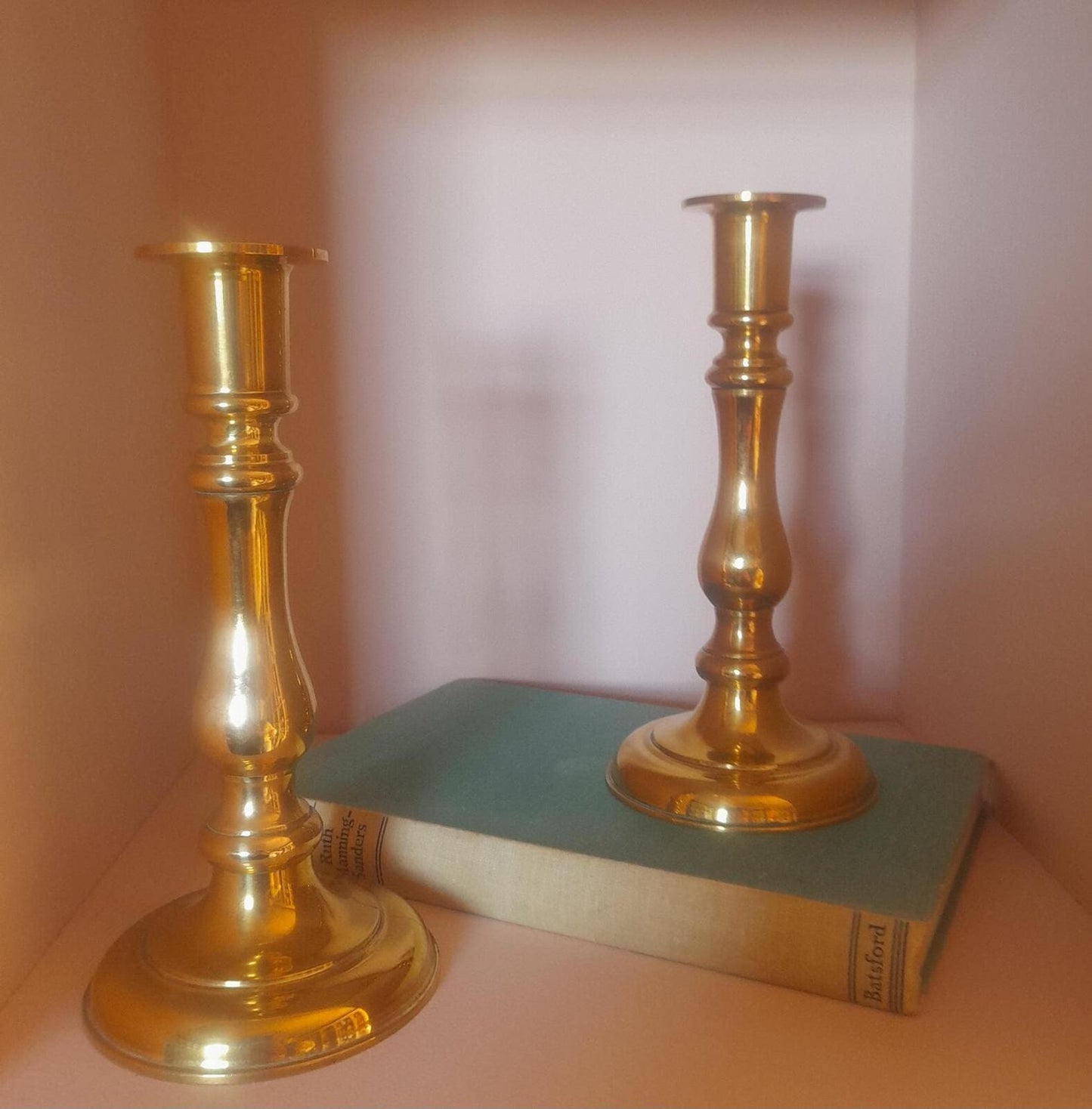 A pair of solid brass candlestick holders