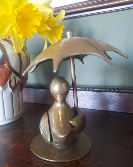 Brass duck with an Umbrella