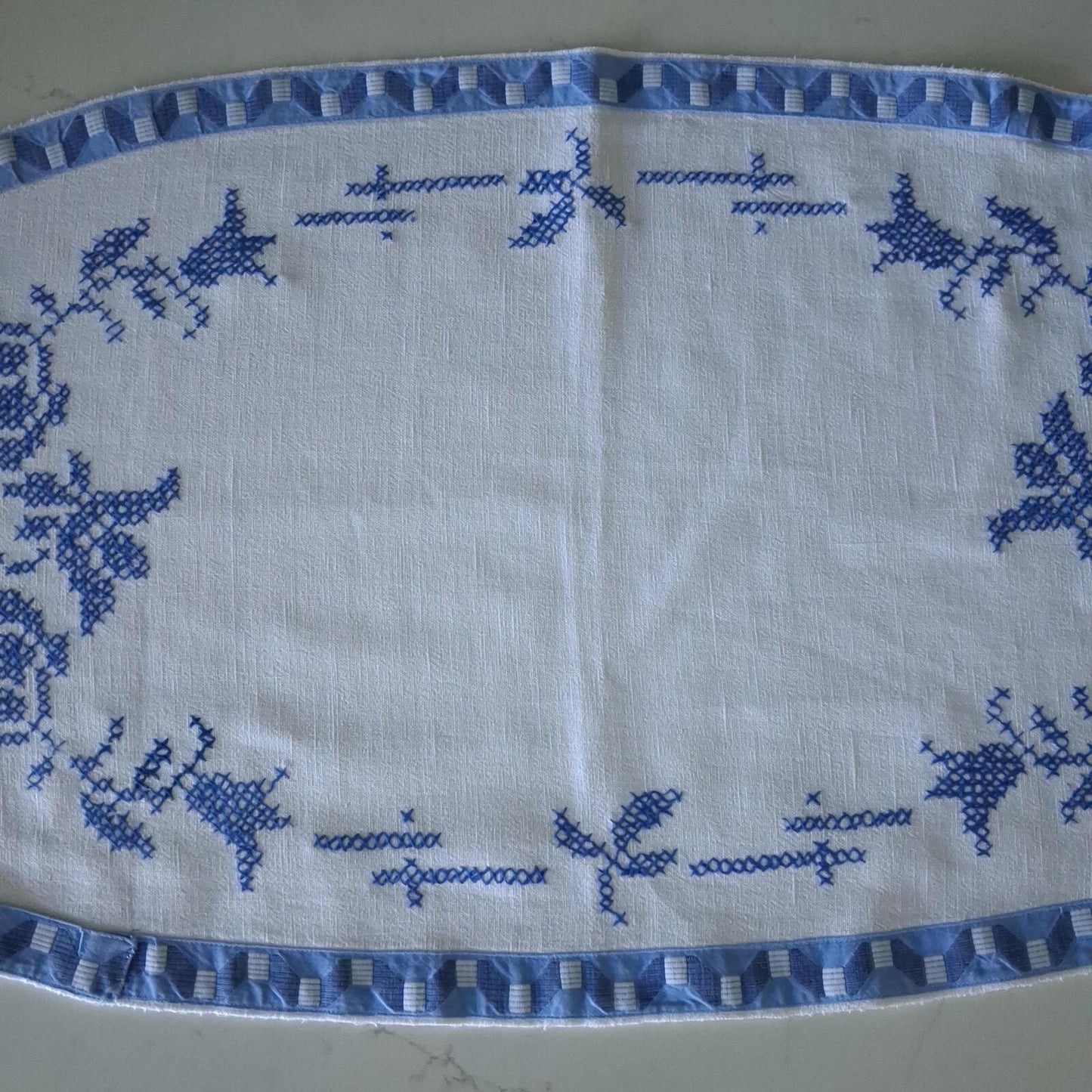 Oval blue and white cross stitch centrepiece cloth 65cm x 34.5cm
