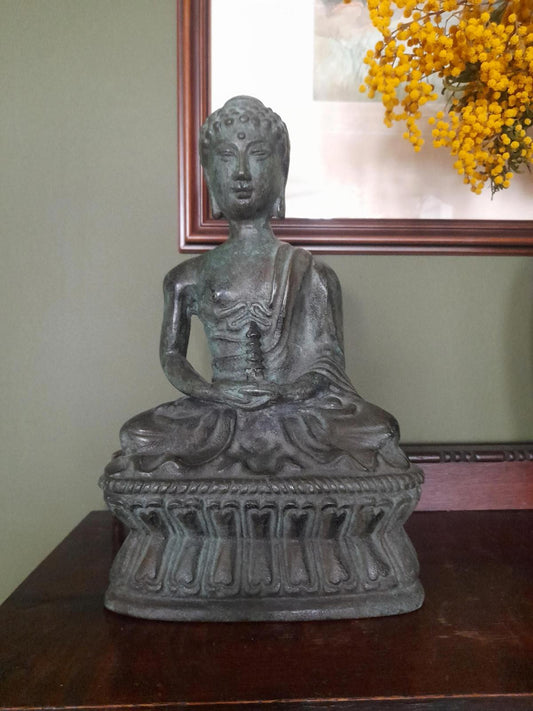 Tibetan bronze figure of a Buddha seated in the lotus position