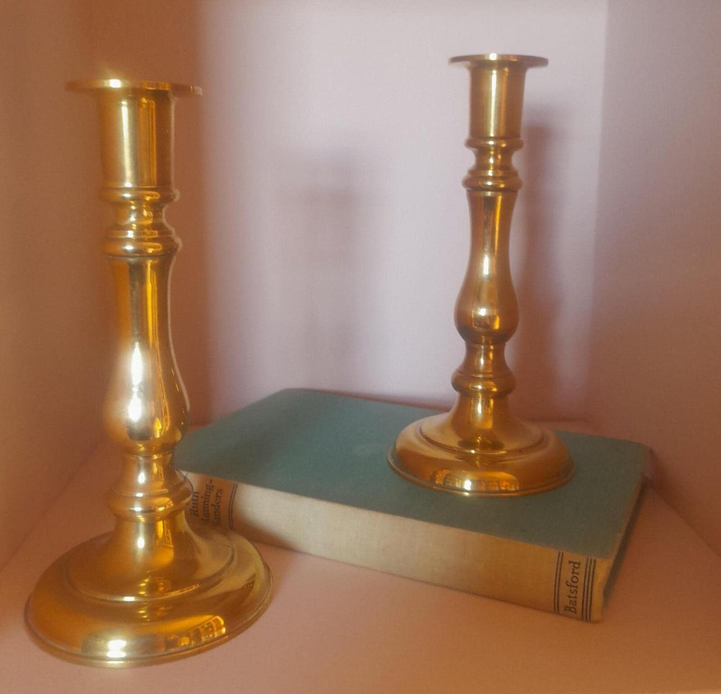 A pair of solid brass candlestick holders