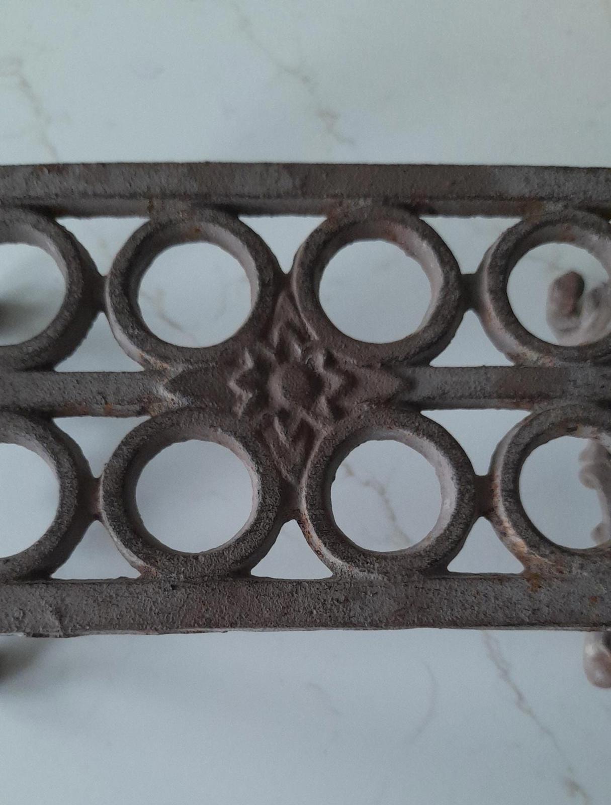 Rustic brown cast iron garden cuttings holder - it will need glass test tubes