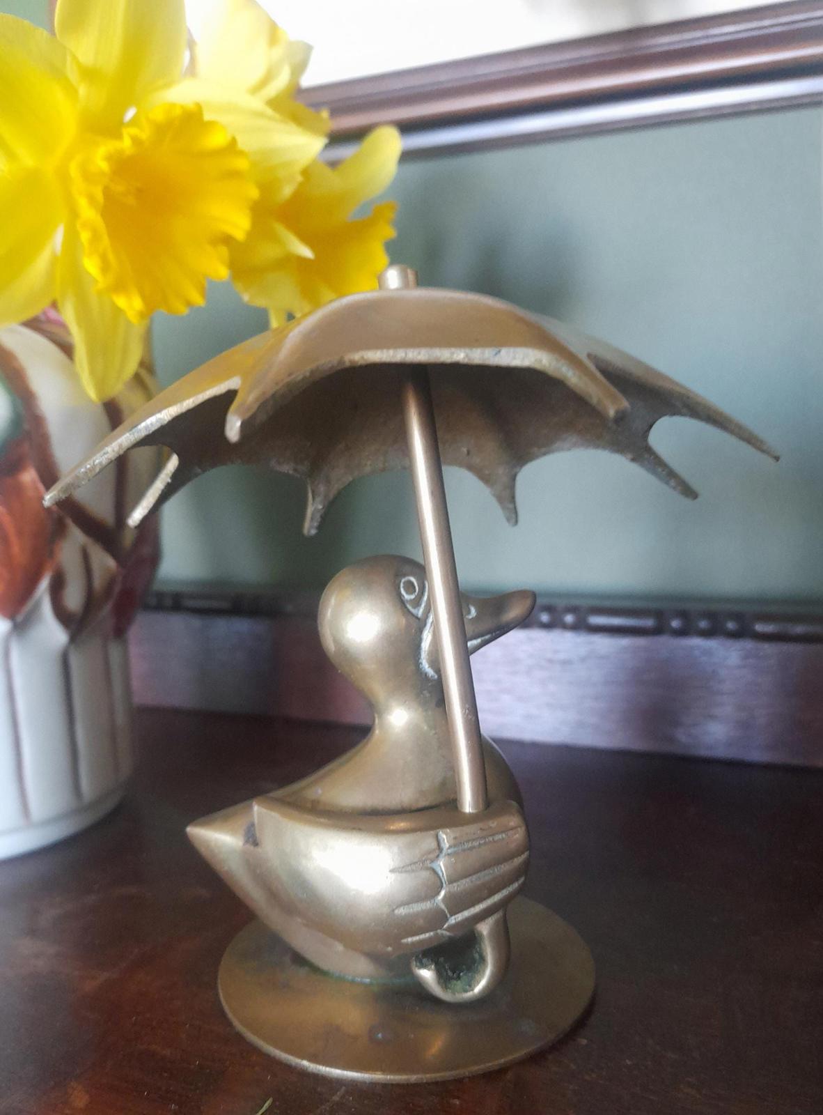 Brass duck with an Umbrella