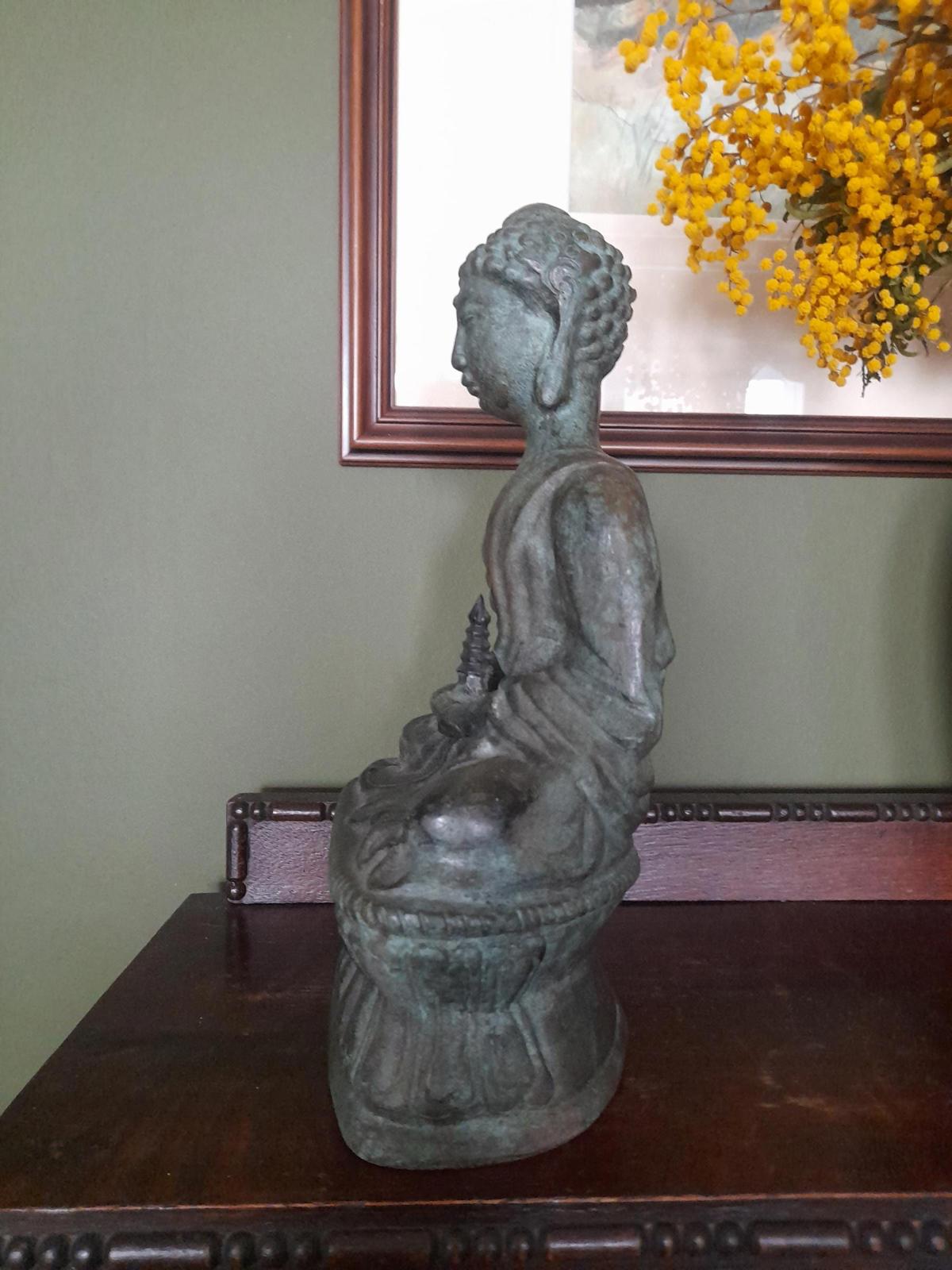 Tibetan bronze figure of a Buddha seated in the lotus position
