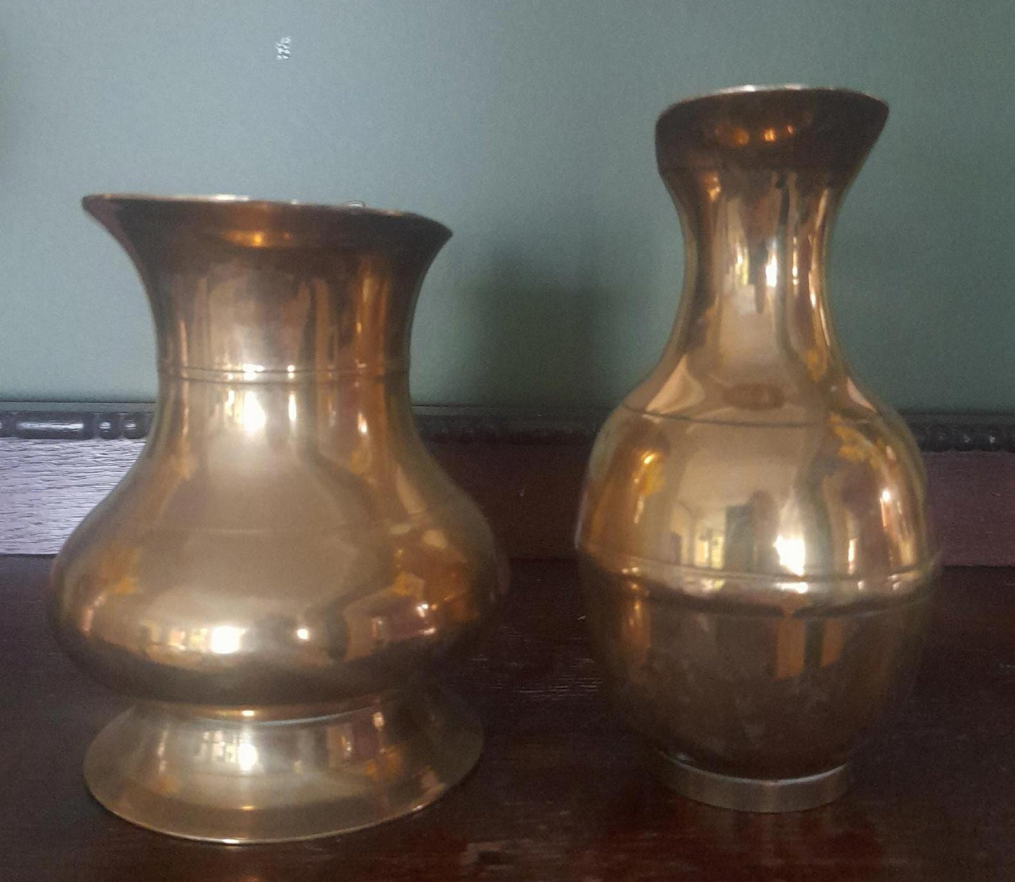 A pair of small brass jugs 5" tall