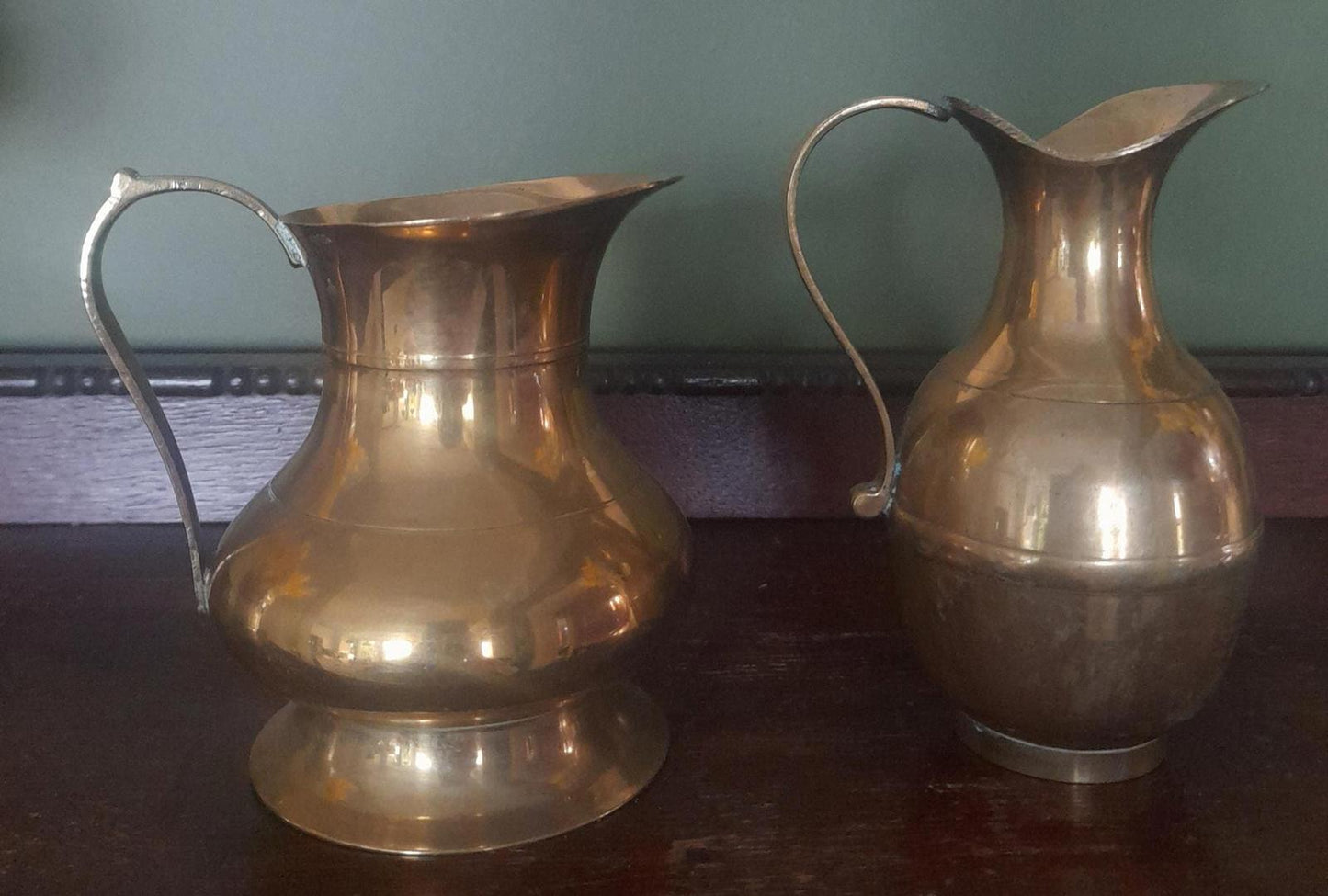 A pair of small brass jugs 5" tall