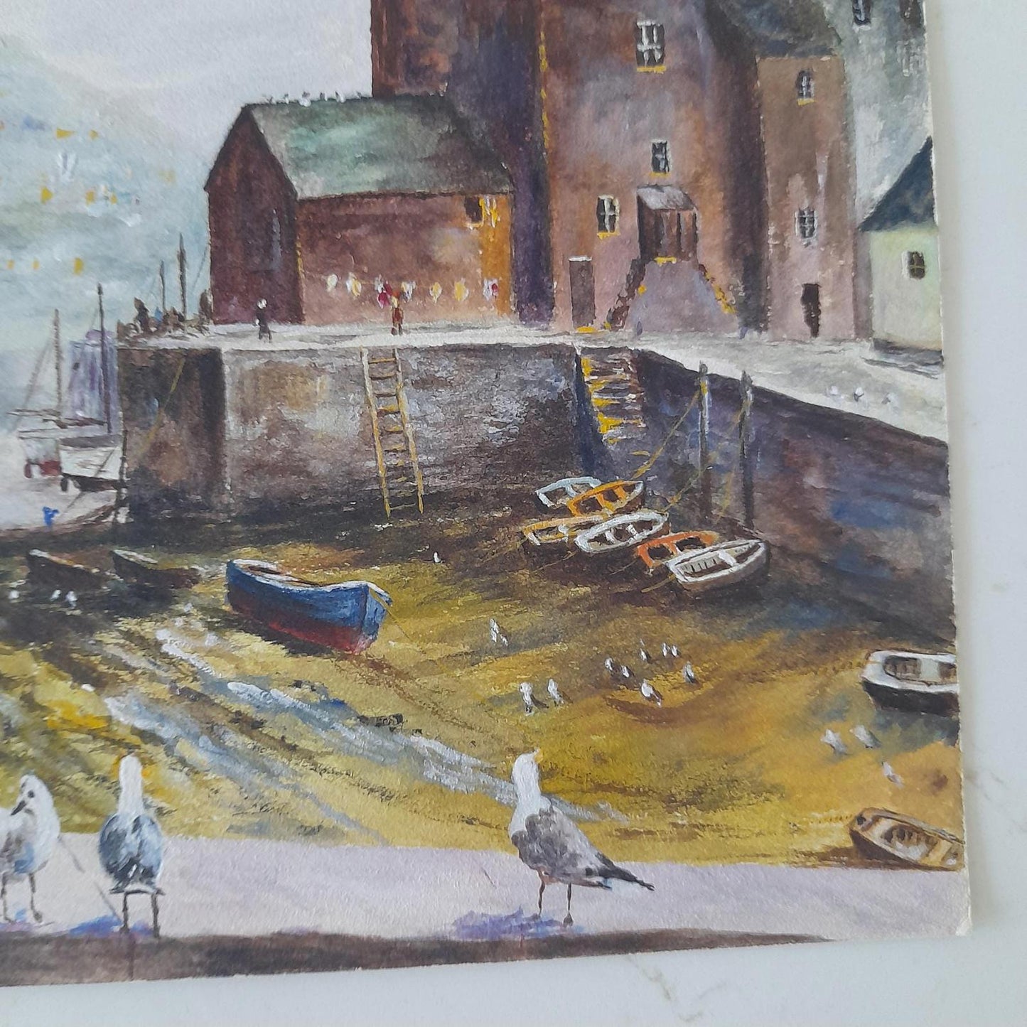 An original painting of a coastal harbor scene by the artist A F Akehurst.