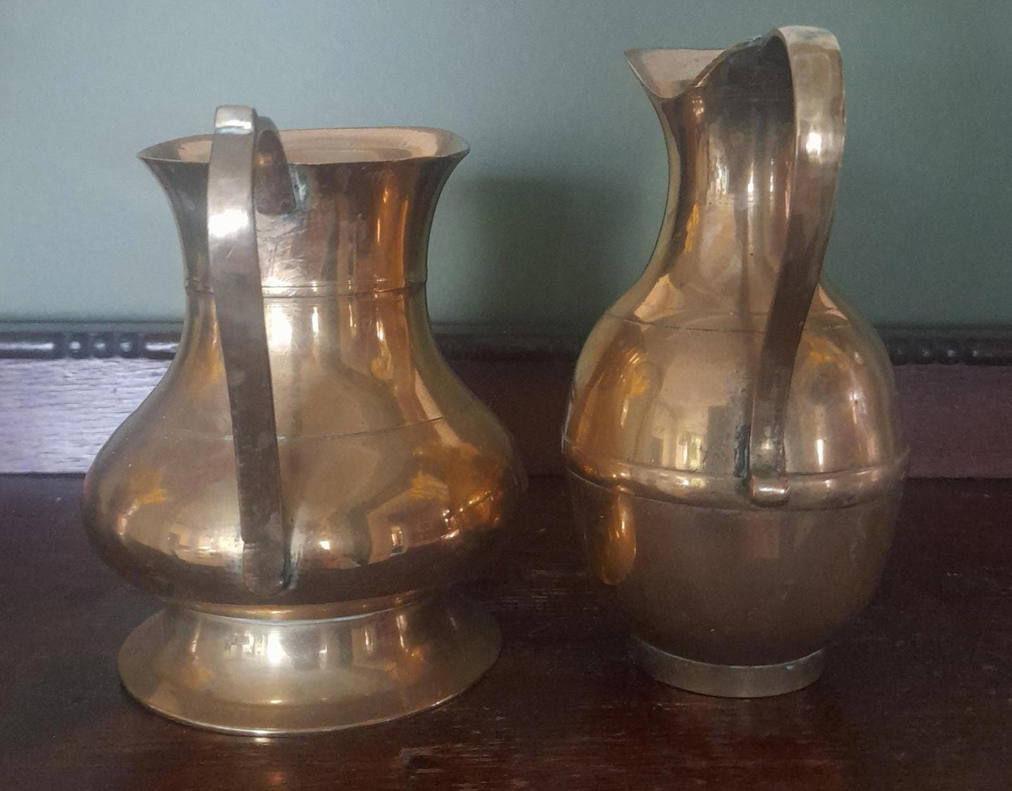 A pair of small brass jugs 5" tall