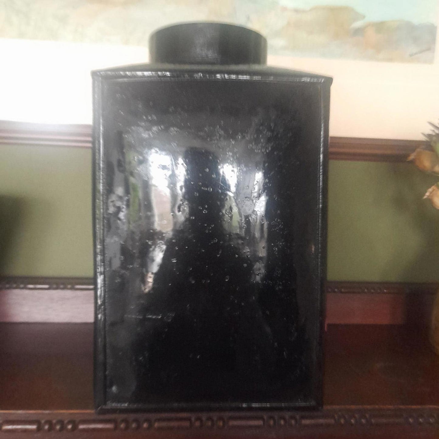 Large metal lidded tin with black lacquered finish hand painted flowers