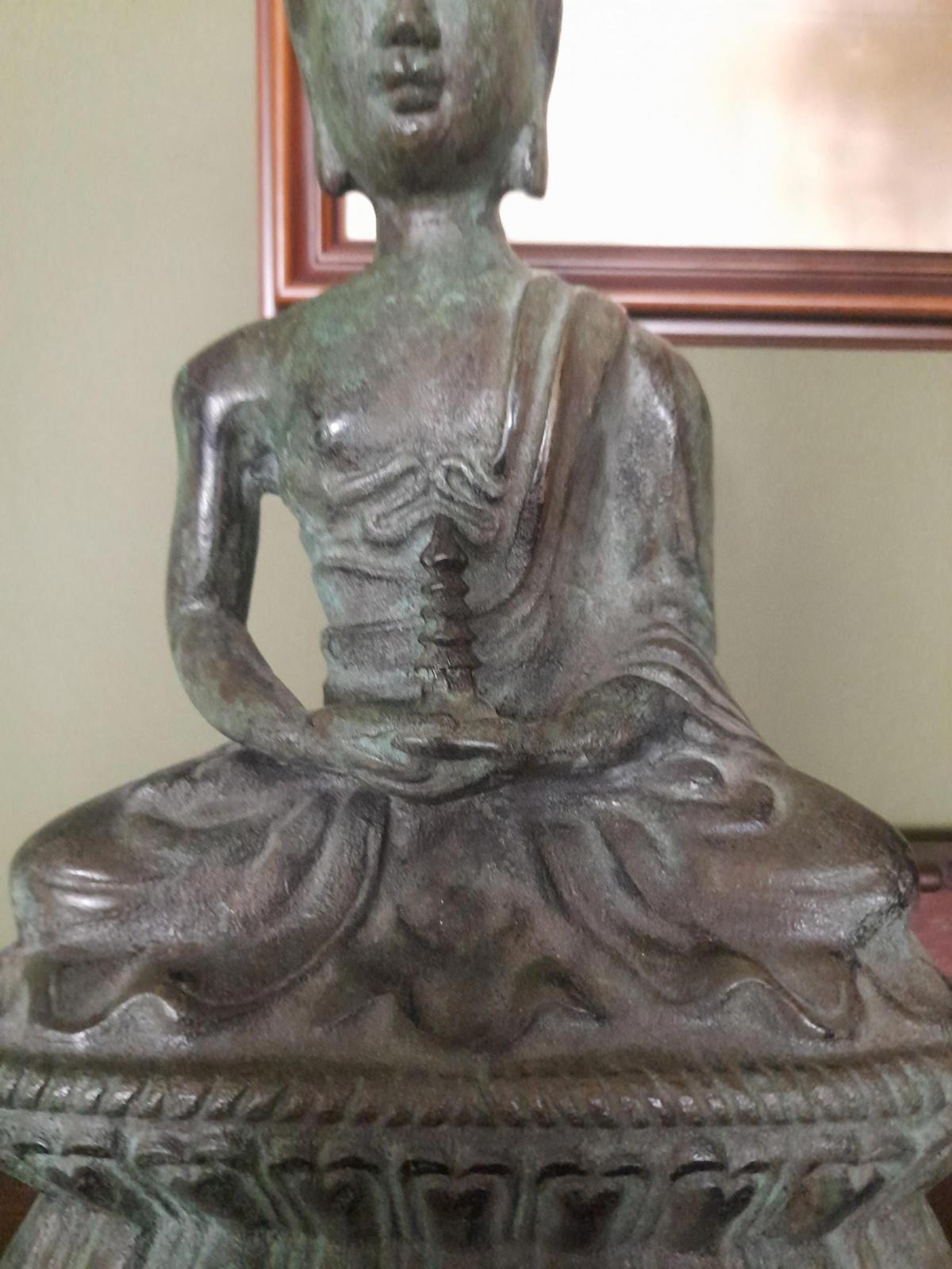 Tibetan bronze figure of a Buddha seated in the lotus position